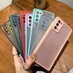 A hand is holding a bunch of contrast matte phone cases, different colors, Samsung models