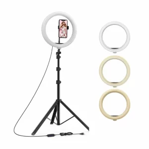 An LED ring light on a tall stand beside 3 other LED ring lights with different light shades