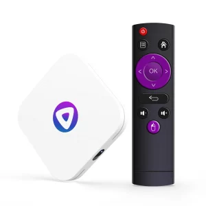 A white rectangle android TV box with its black remote beside eachother